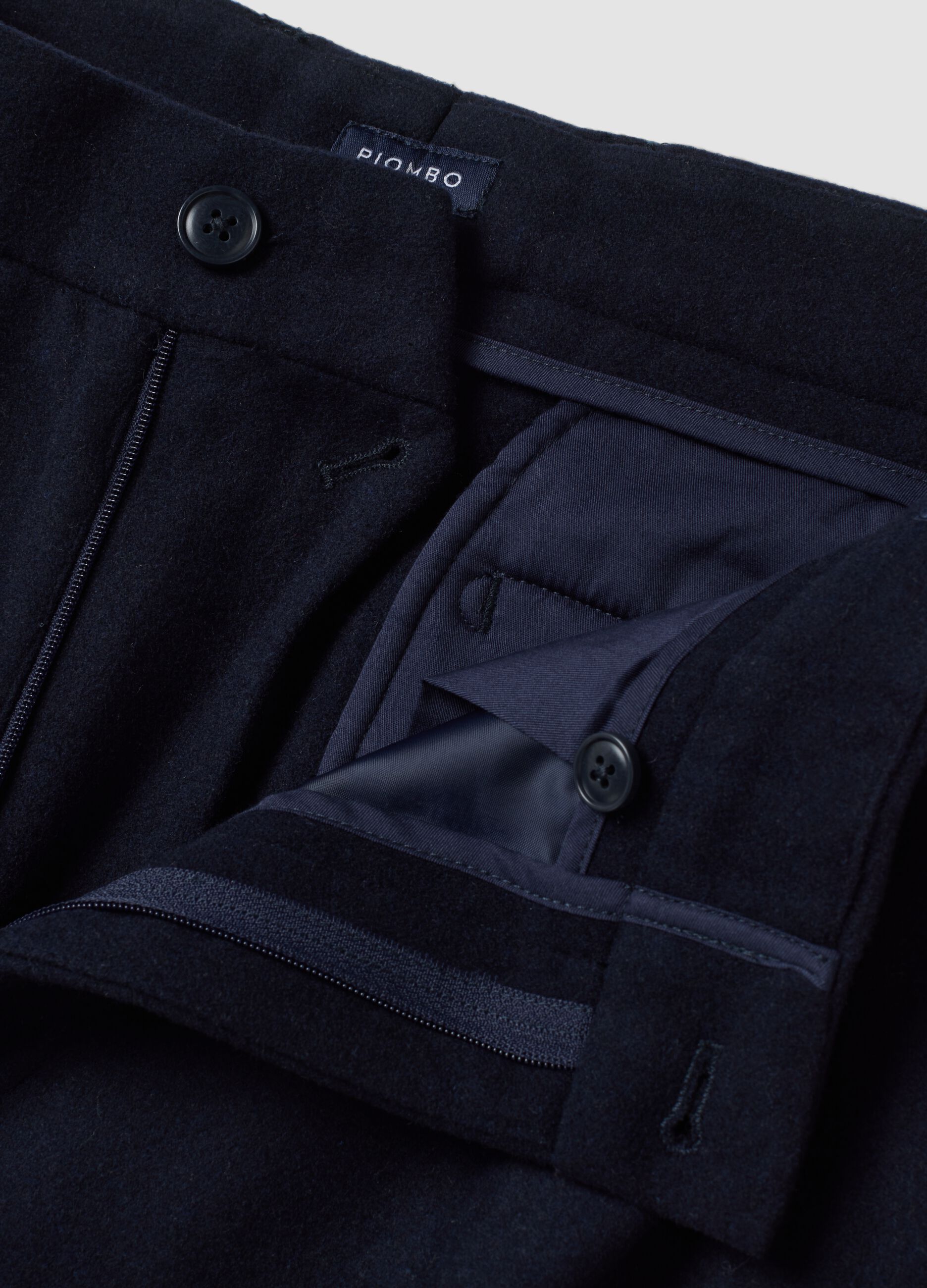 Navy blue formal carrot-fit trousers in wool and viscose blend