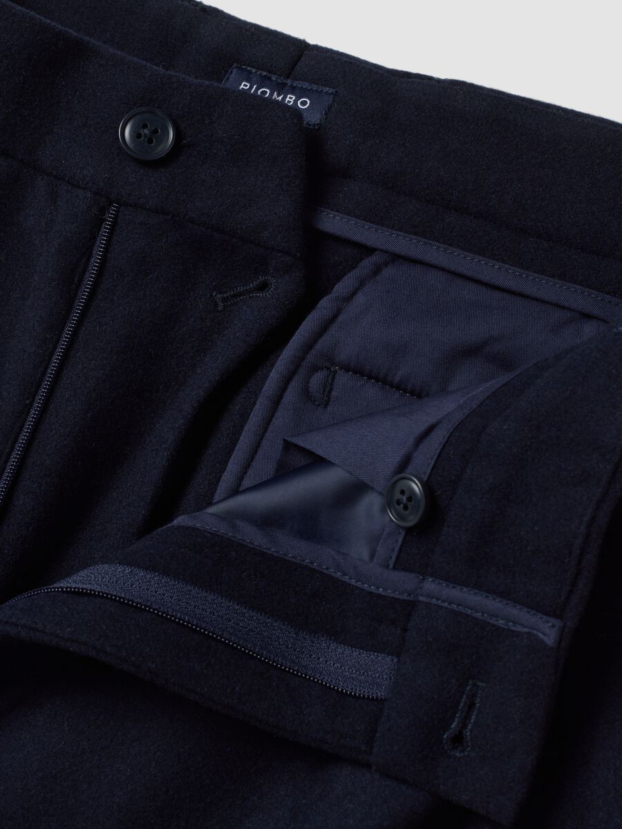 Navy blue formal carrot-fit trousers in wool and viscose blend_1