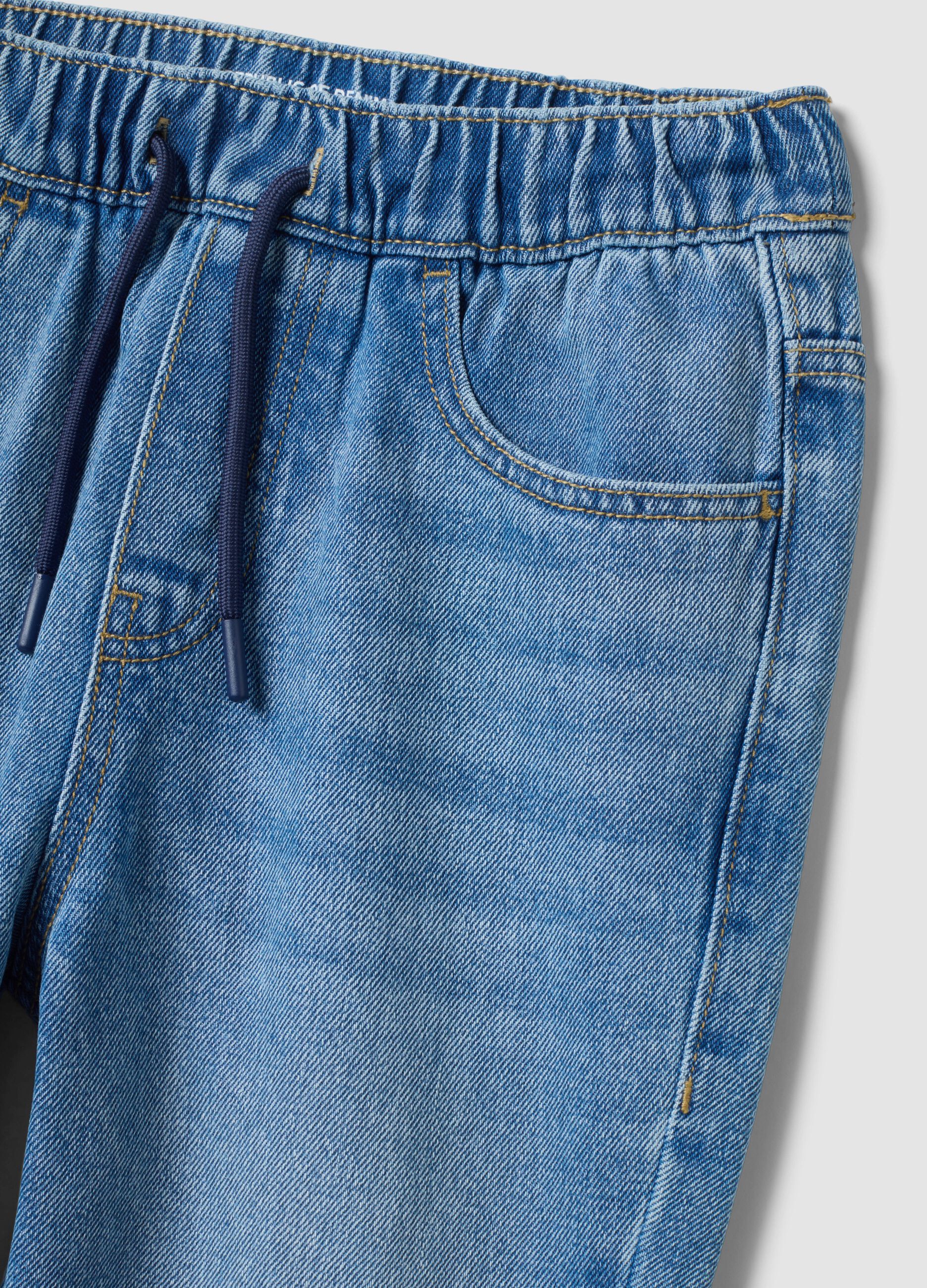 Blue denim jogger jeans in a cotton and viscose blend for boys