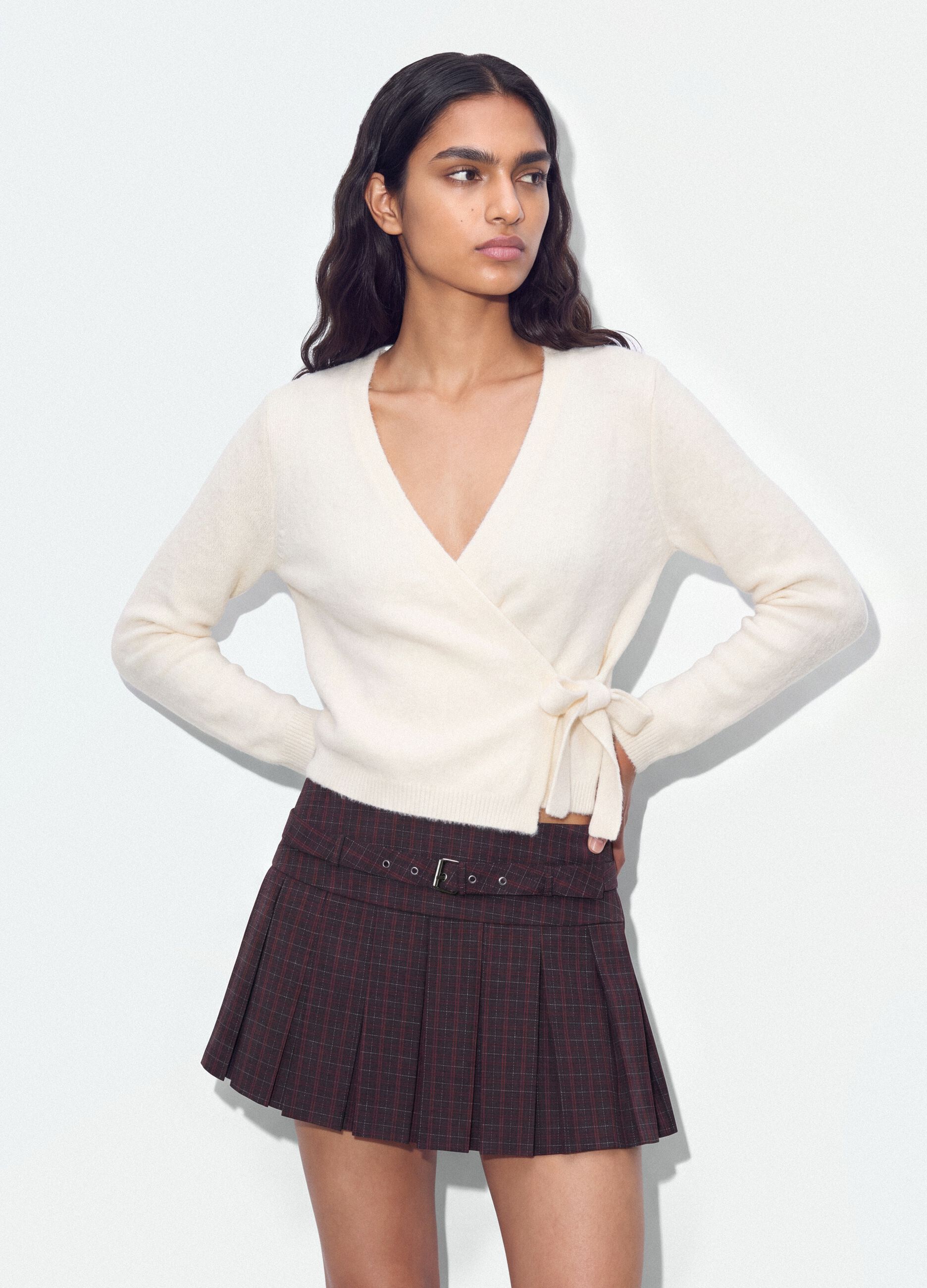 White wrap cardigan with deep V-neck