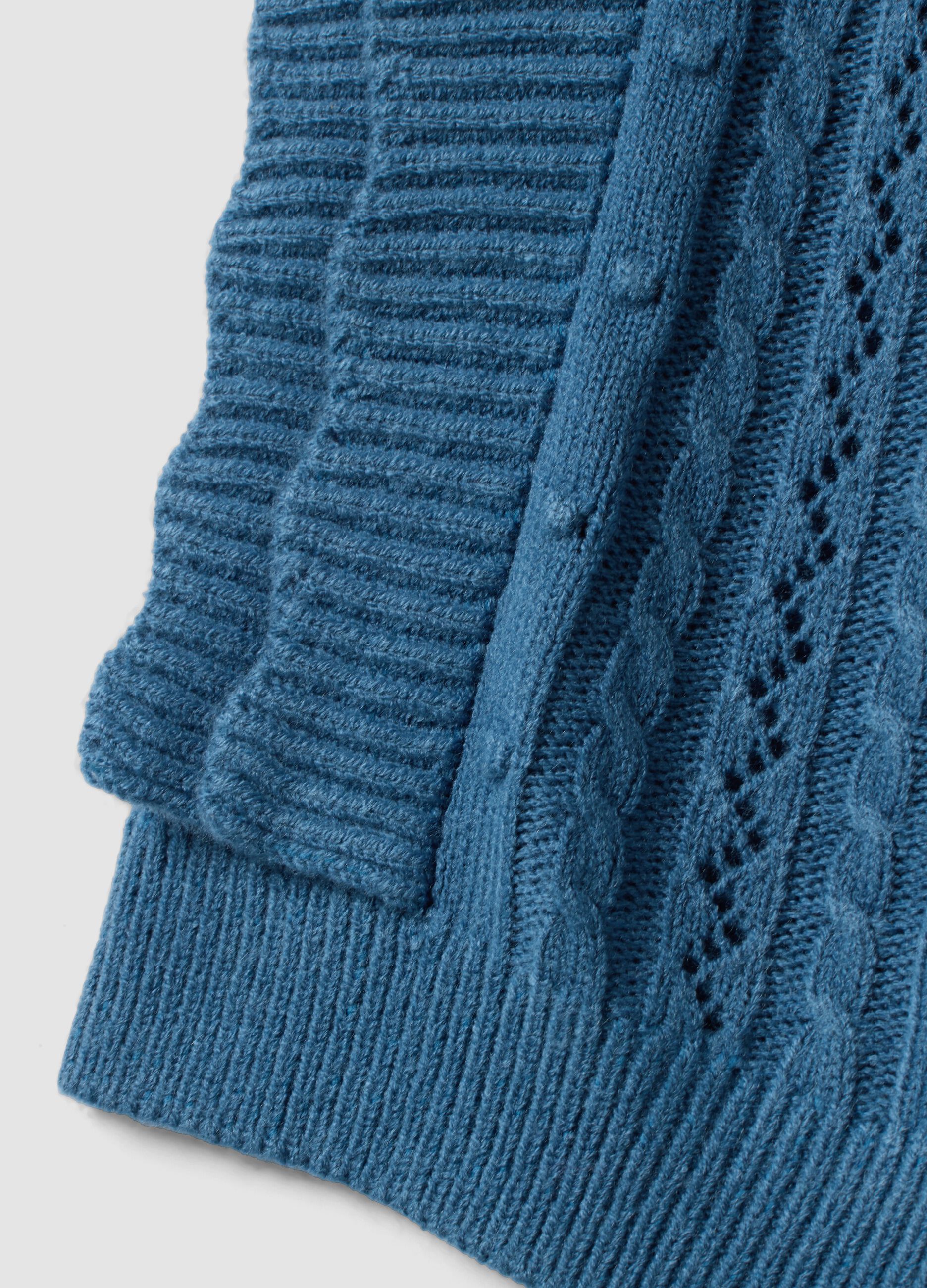 Blue knitted gilet with ruffles and cable knit