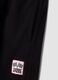 Pantaloni jogger neri in puro cotone con fondo elastico_2