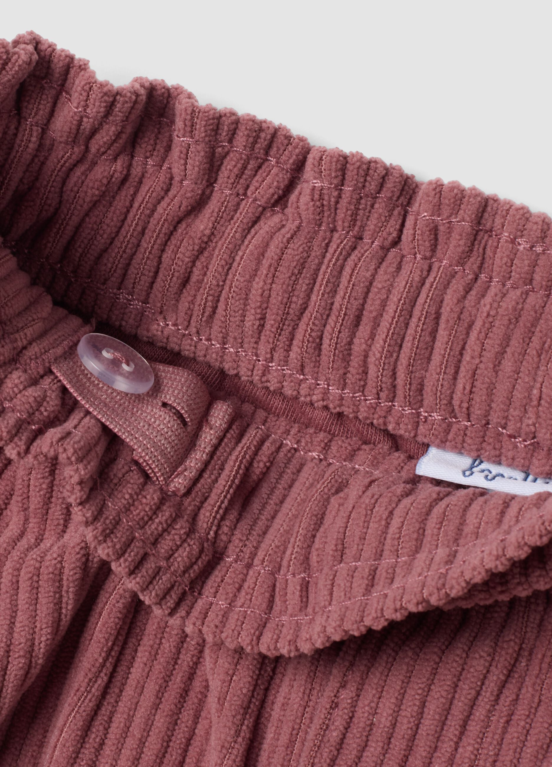 Pink corduroy trousers with elasticated waistband