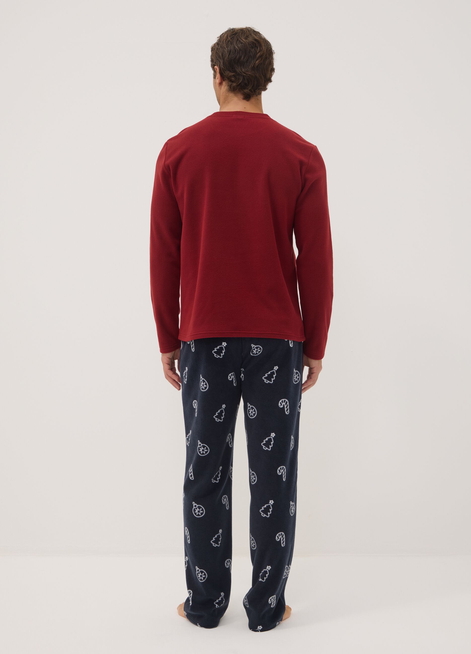 Long red pyjama set with crew neck top and patterned trousers