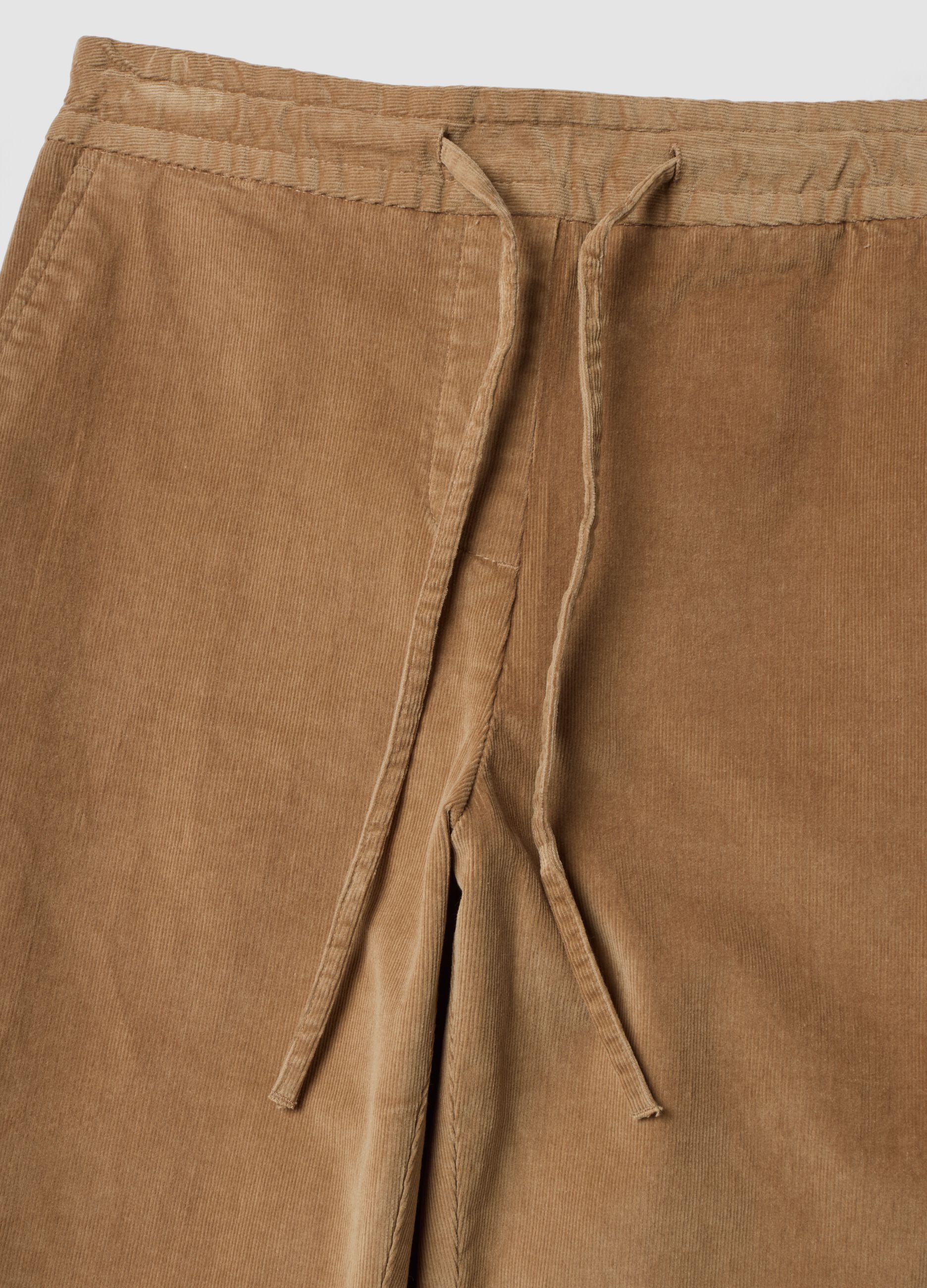 Beige ribbed stretch cotton trousers with elasticated waistband