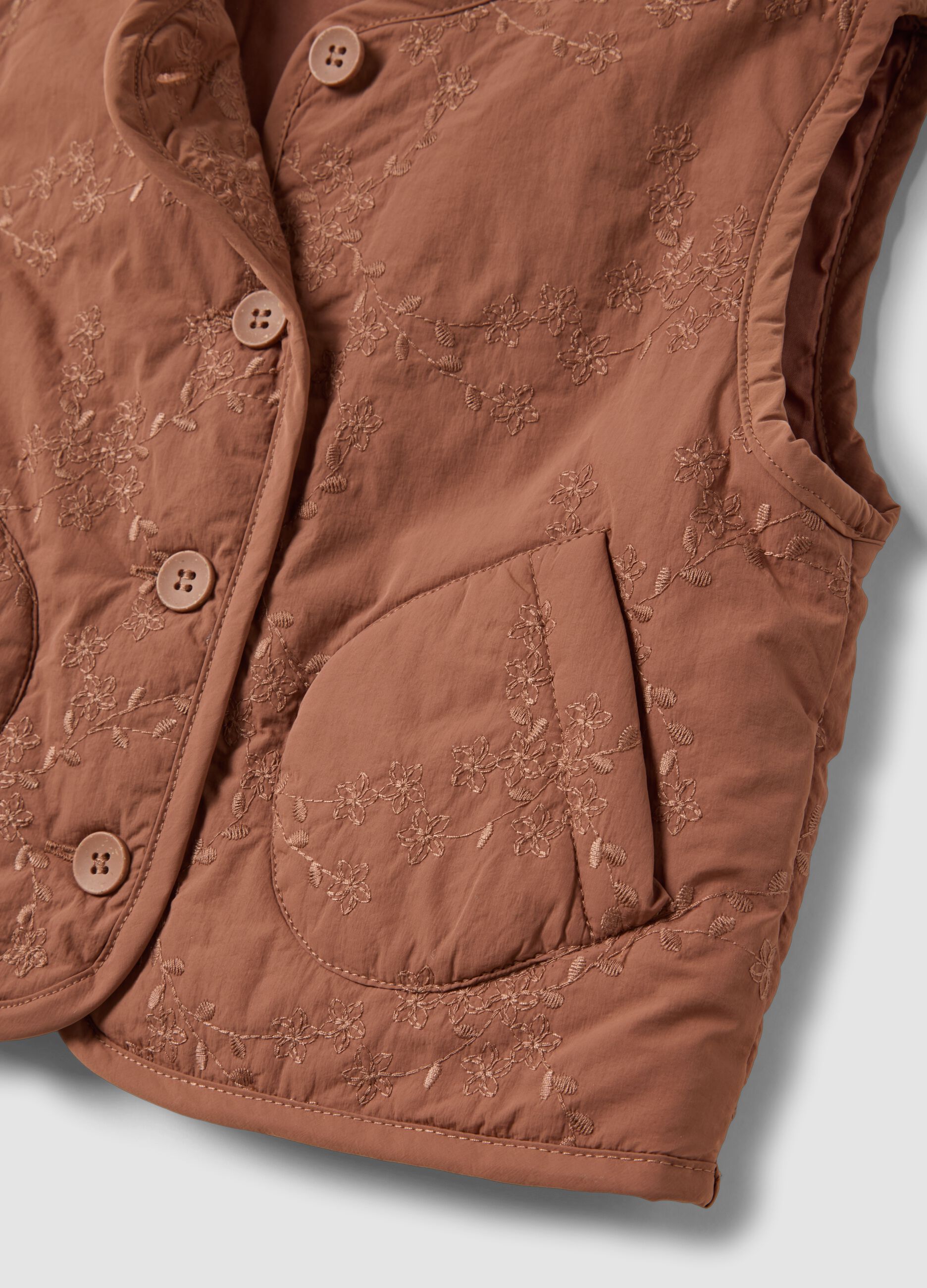 Brown padded gilet with floral embroidery