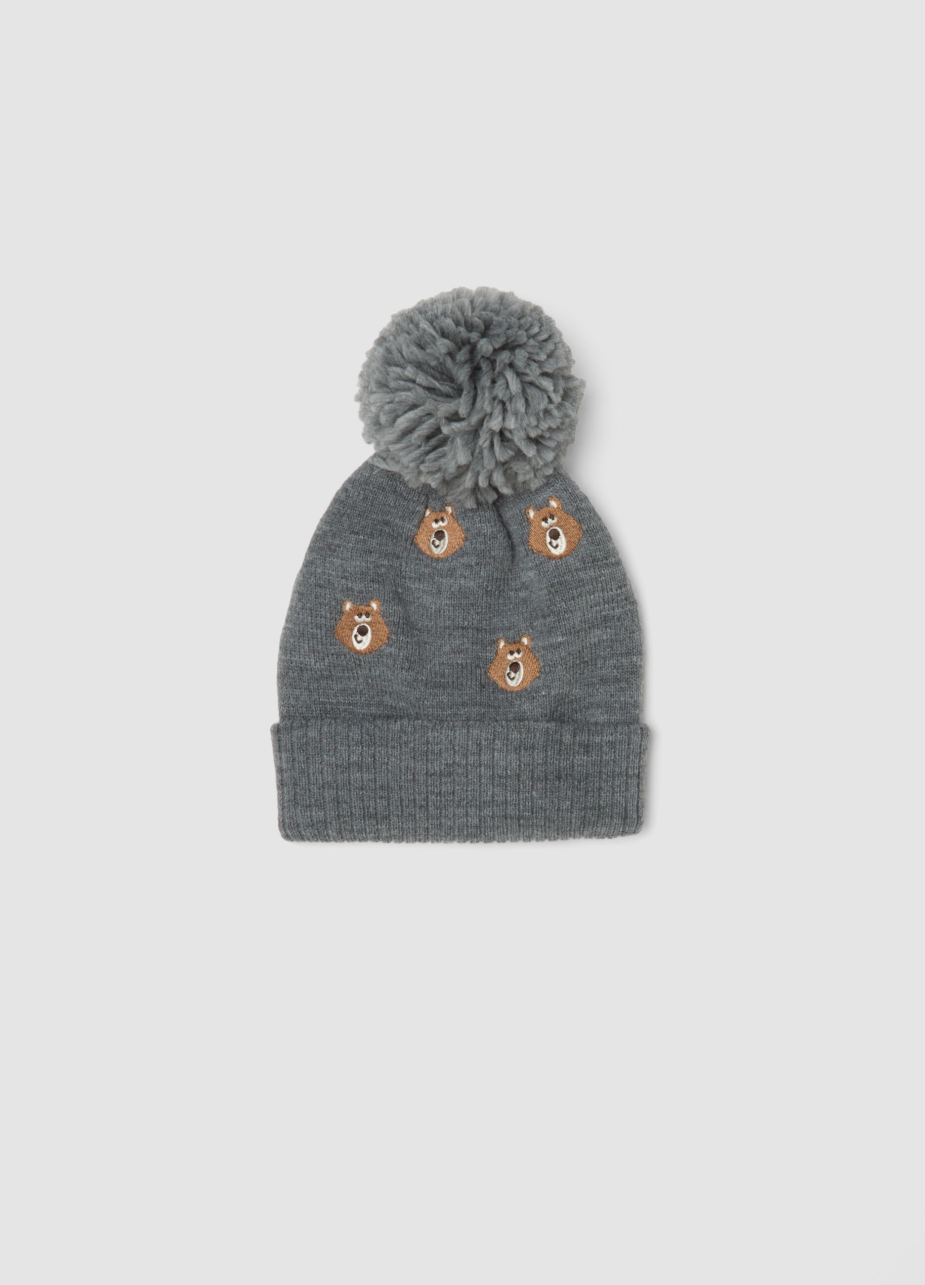 Grey knitted hat with pom pom and teddy bear pattern