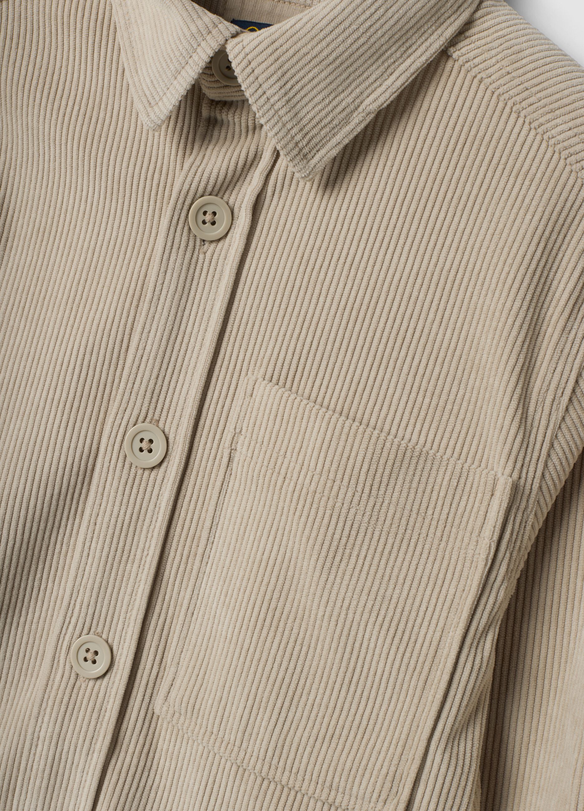 Beige ribbed shirt with buttons and chest pocket