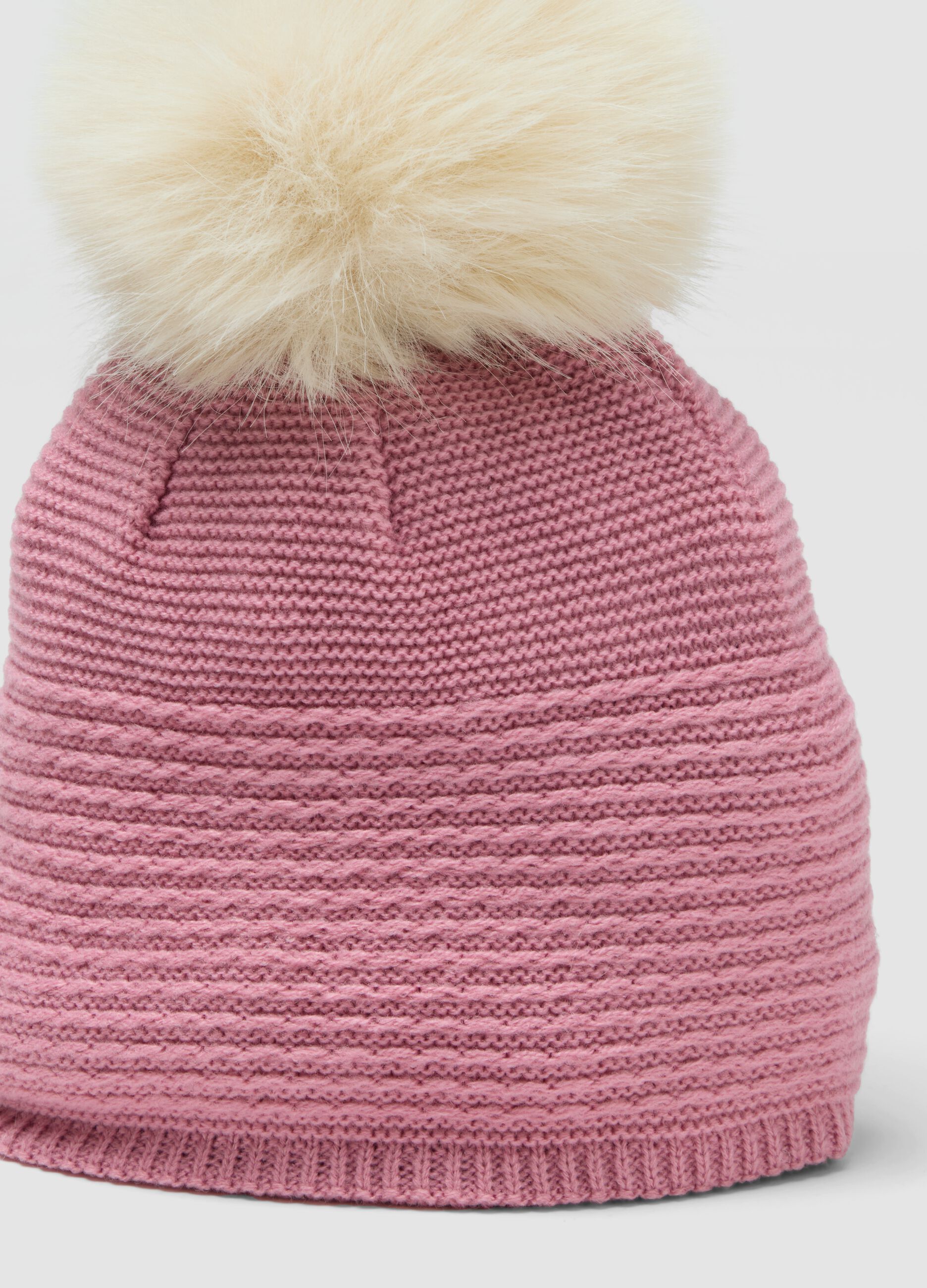 Pink knitted hat with pompom