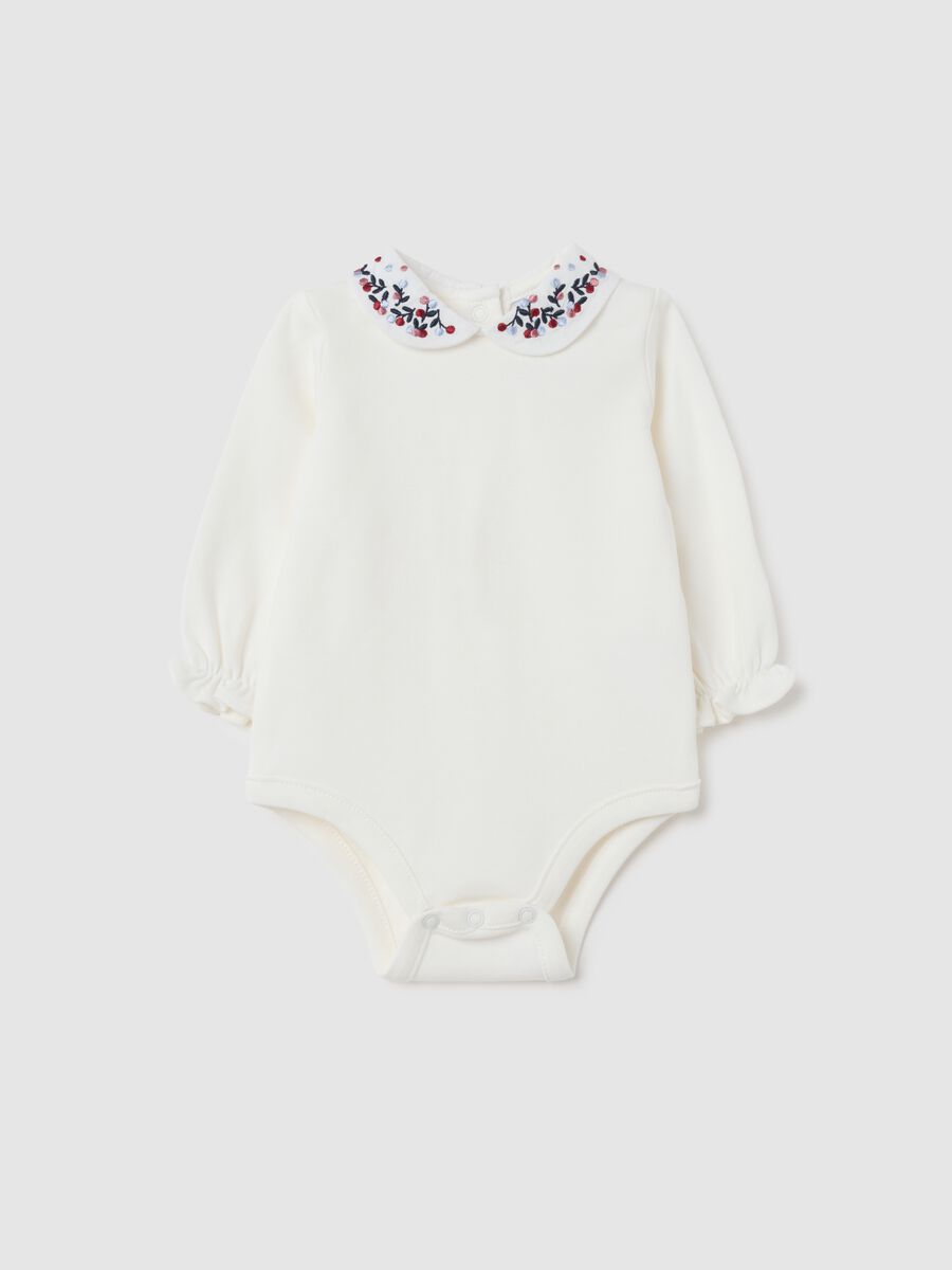 Newborn baby bodysuit in pure white cotton with ruffled collar_0