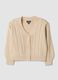 Cardigan beige in maglia con scollo profondo a V_0
