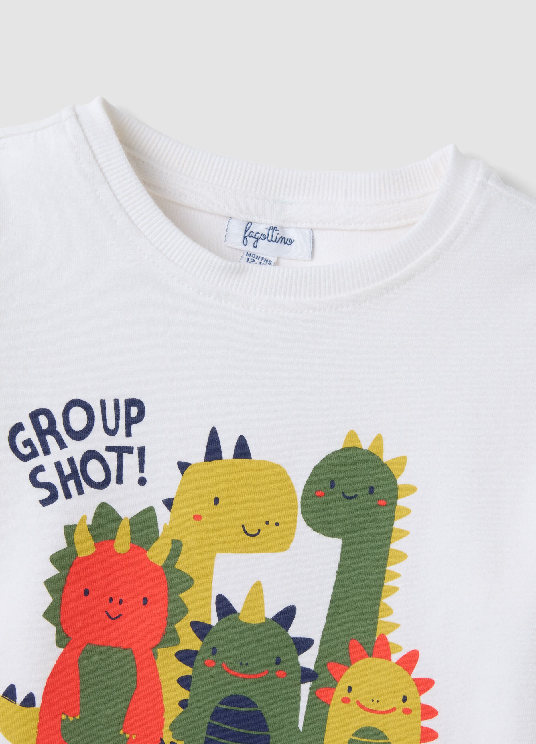 T-shirt bianca in cotone organico elasticizzato con dinosauri over fit