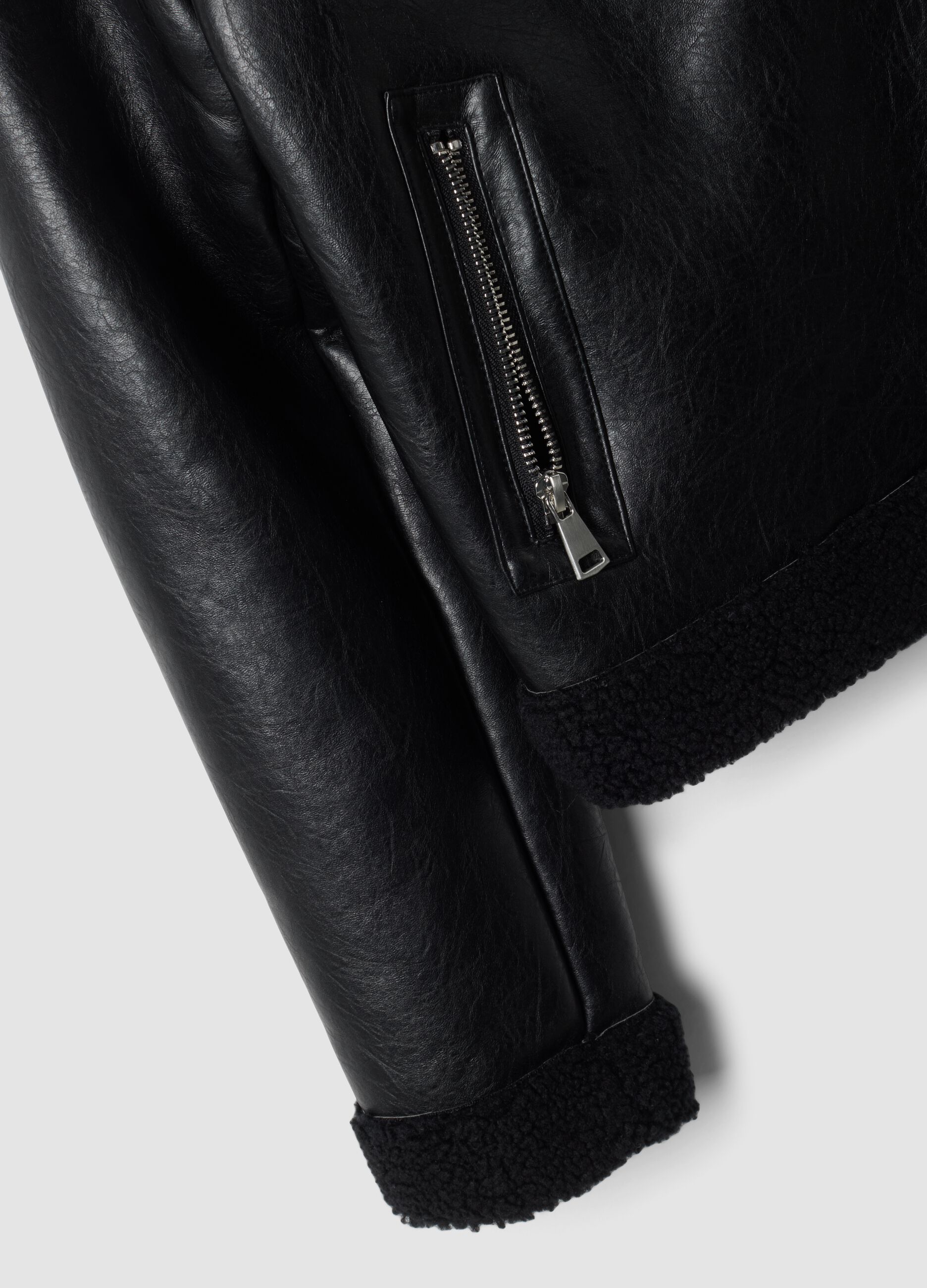Black aviator-style jacket with diagonal zip