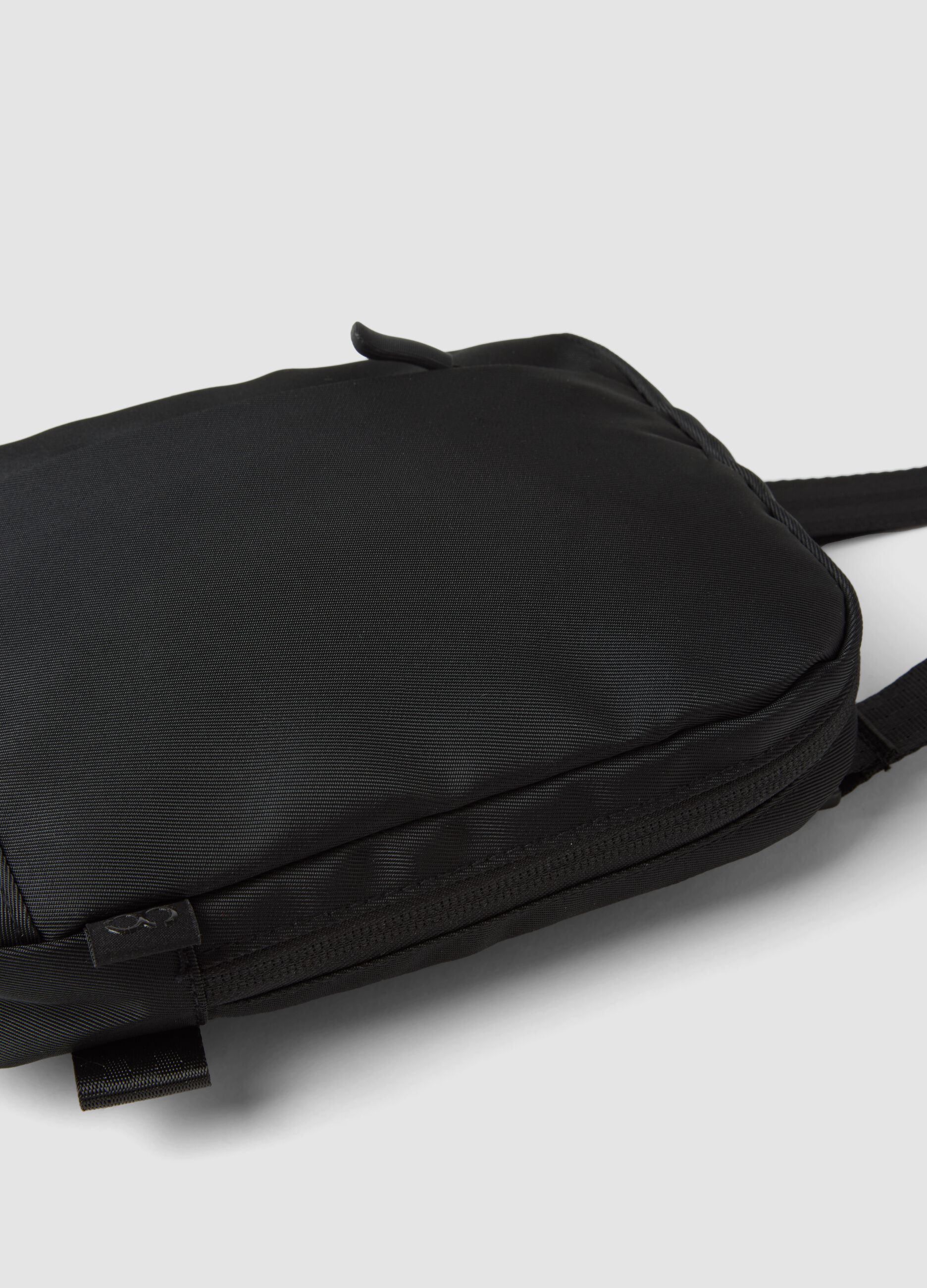 Black water-repellent crossbody pouch with zip