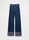 Wide denim trousers with floral turn-up_6