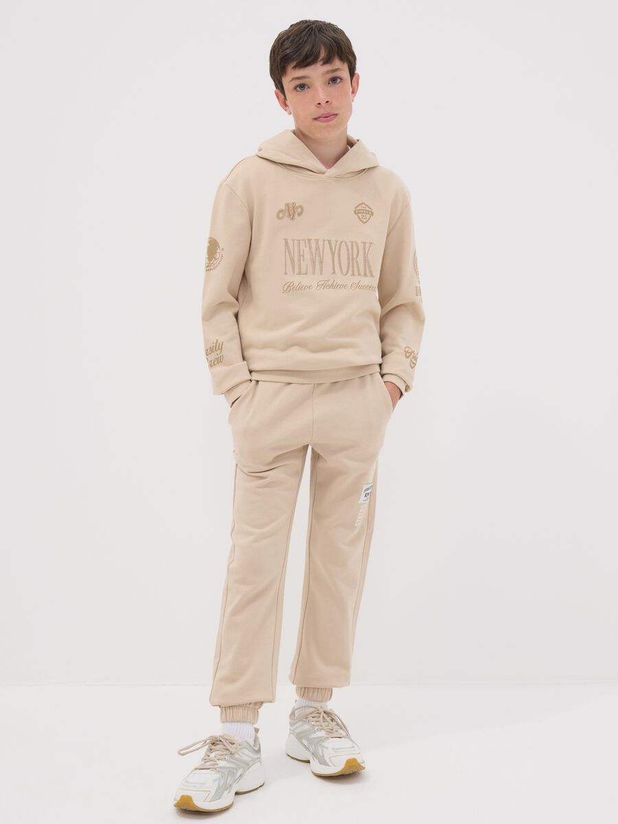 Beige pure cotton joggers with print for boys_0