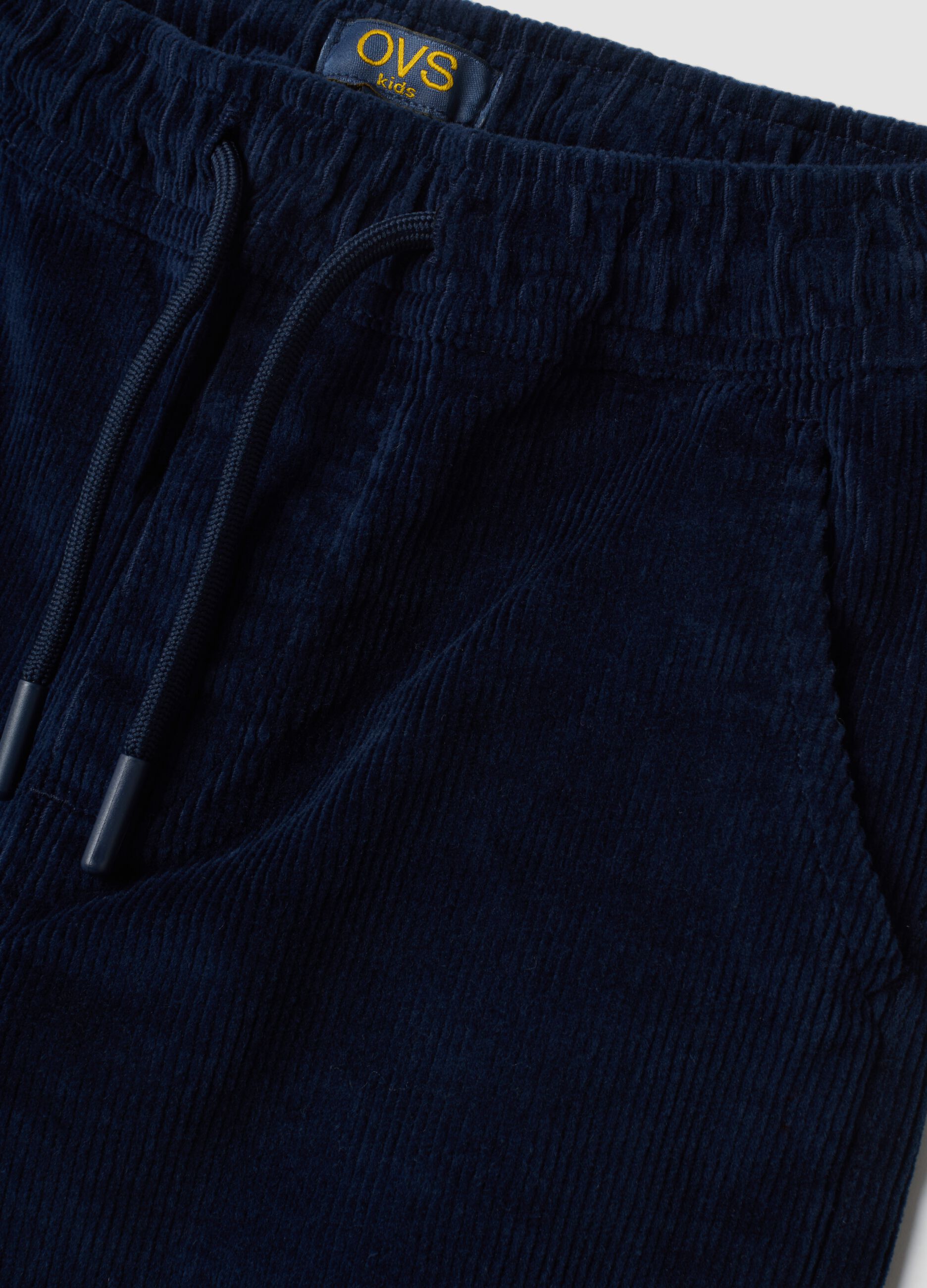 Pantaloni blu scuro in cotone elasticizzato a coste