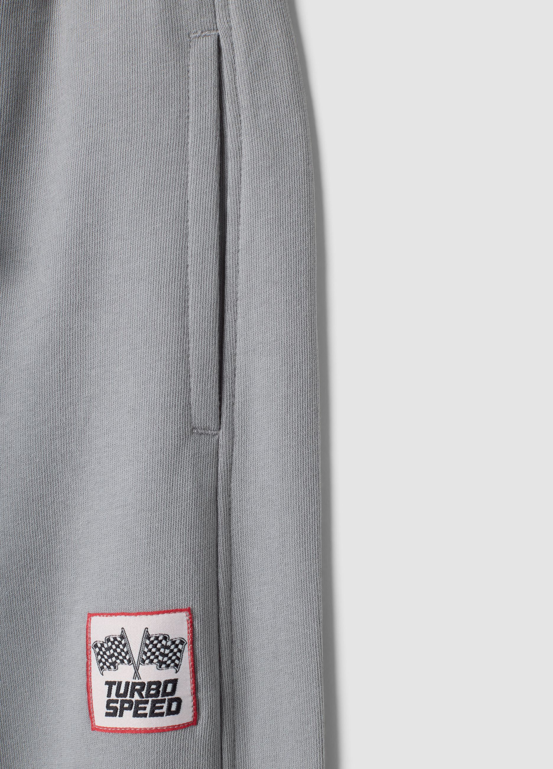 Pantaloni jogger grigi in puro cotone con fondo elastico