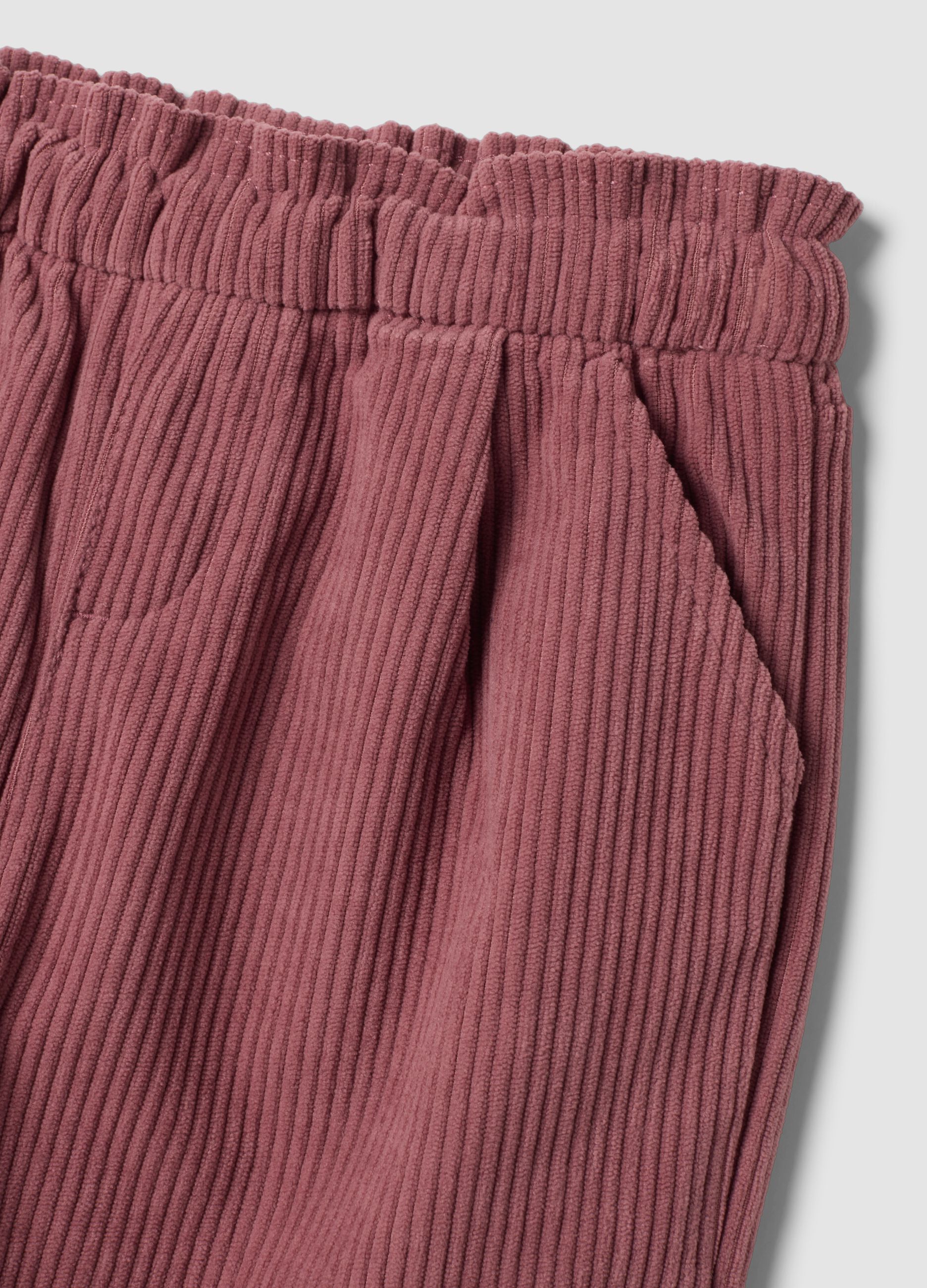 Pink corduroy trousers with elasticated waistband