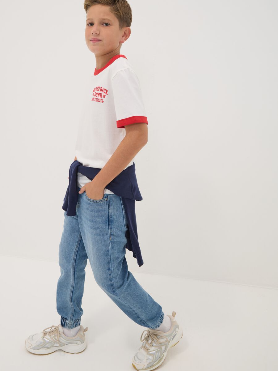 Blue denim jogger jeans in a cotton and viscose blend for boys_0