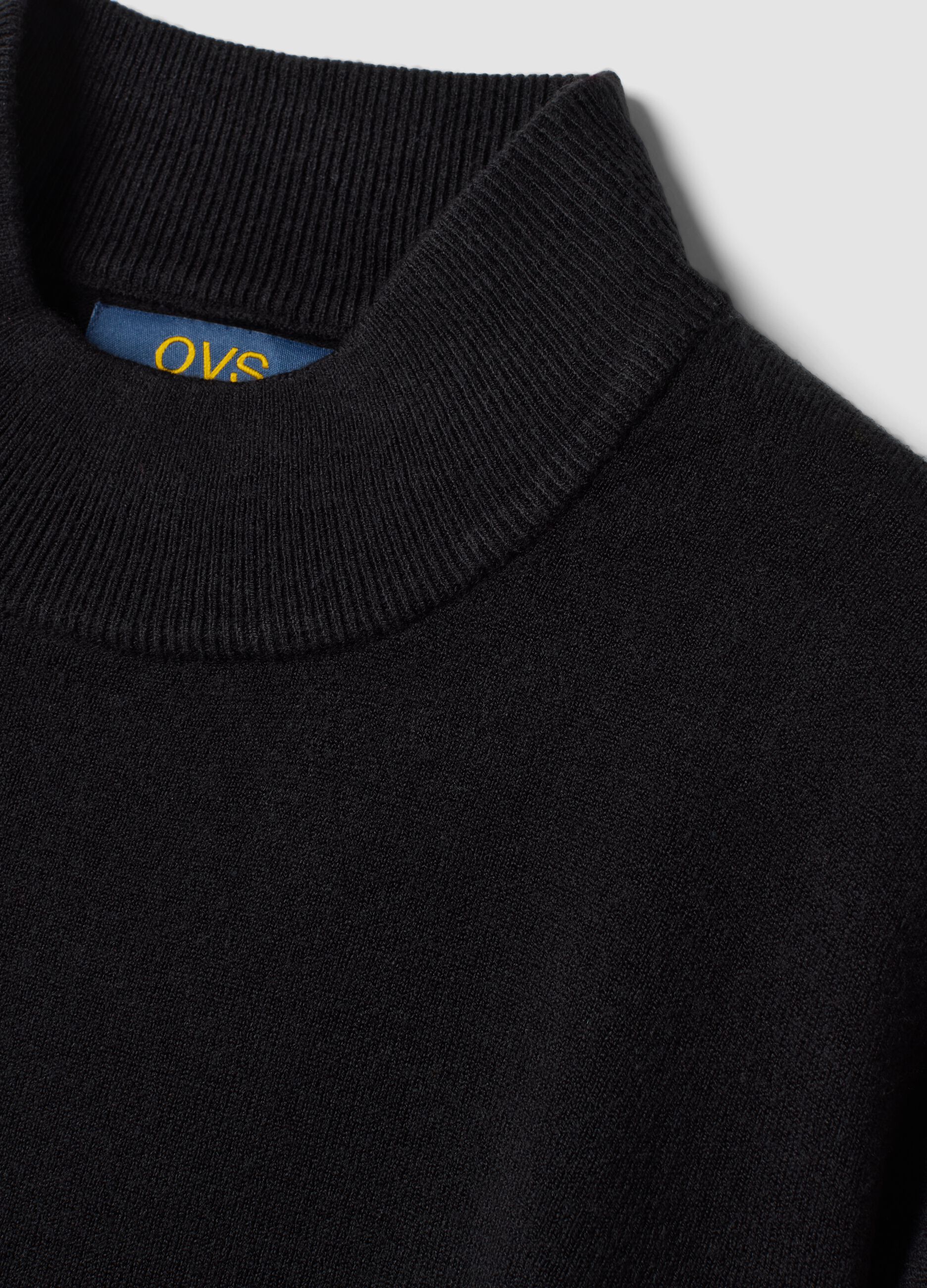 Black long-sleeve top with raised neckline, regular fit