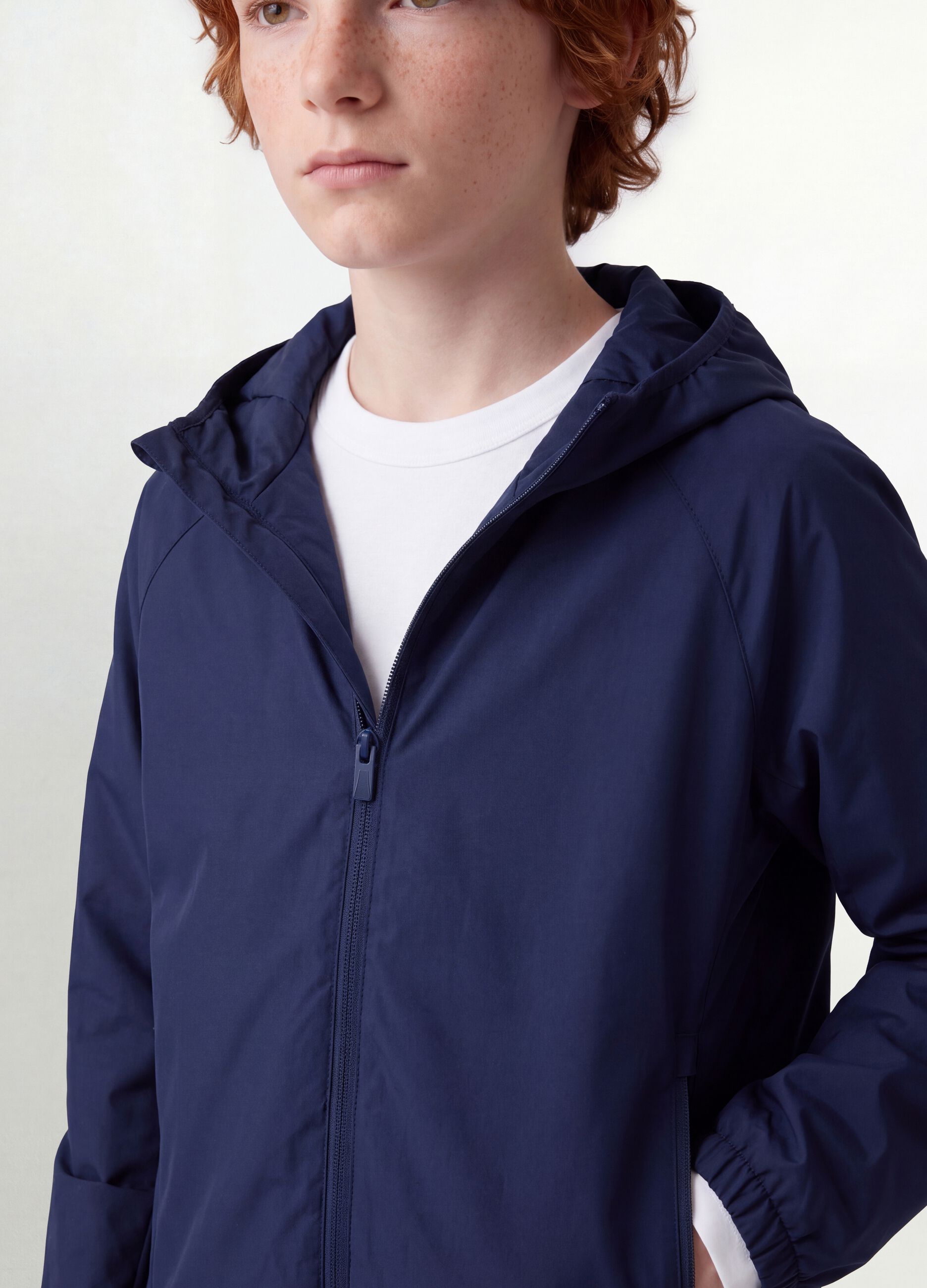 Blue boys&rsquo; rain jacket with hood and zip