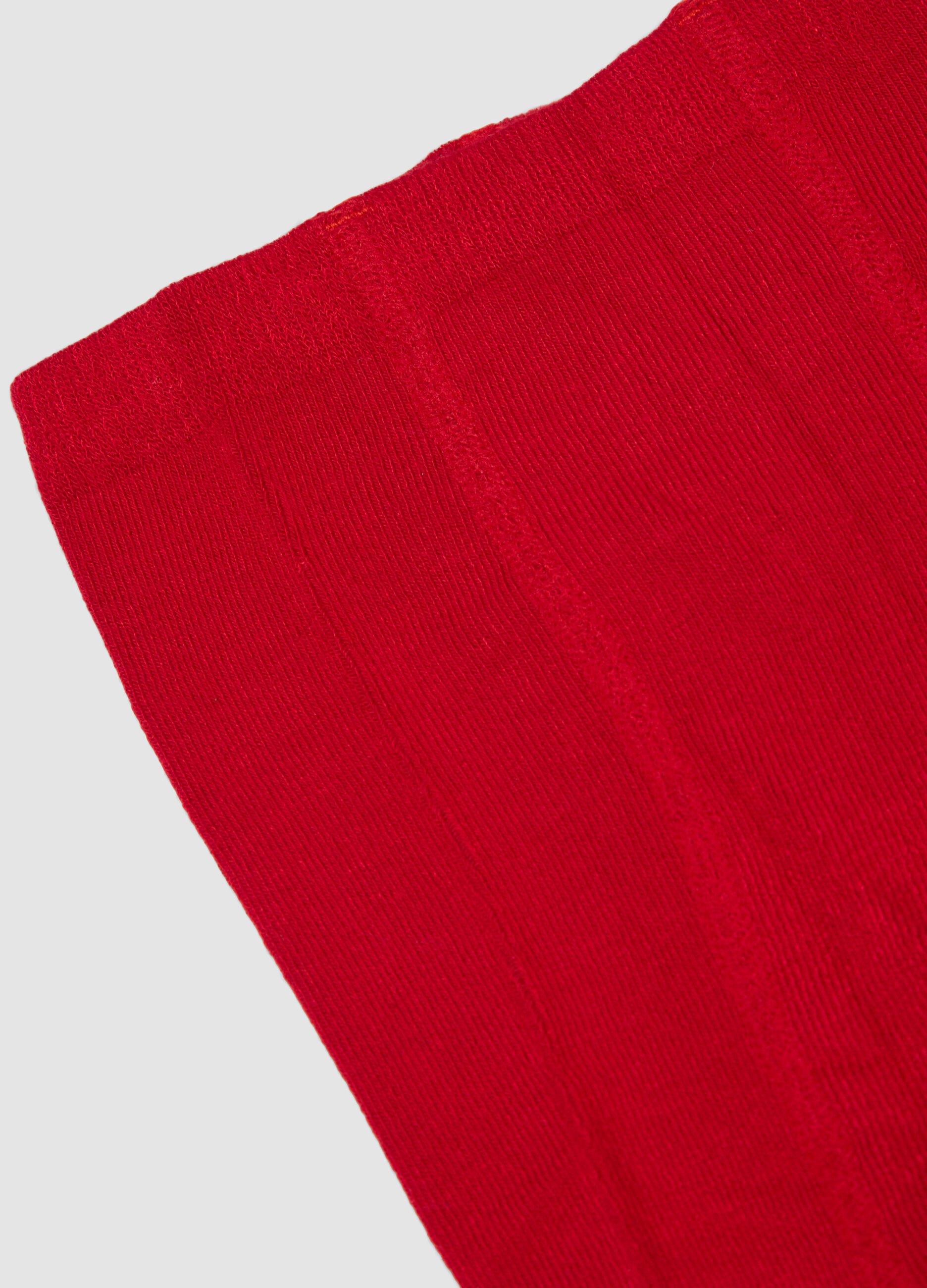 Collant rosso in tessuto elasticizzato con fiocco