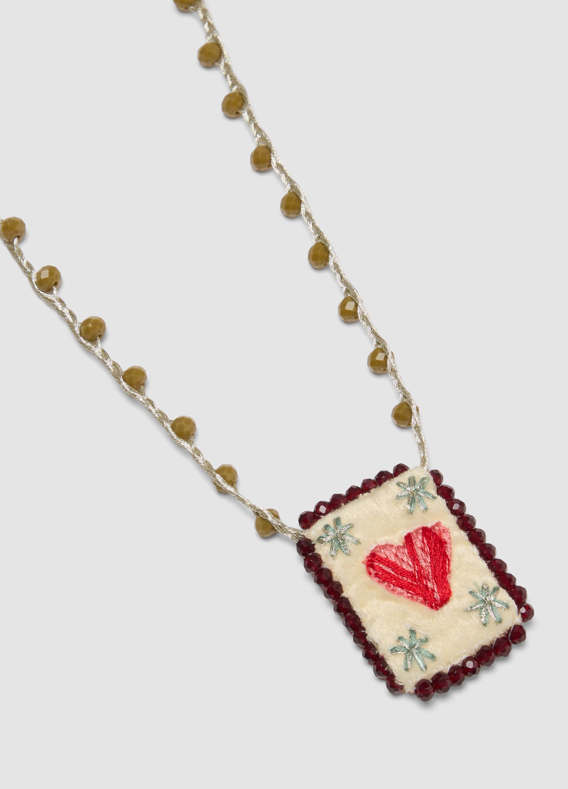 Green necklace with embroidered heart pendant
