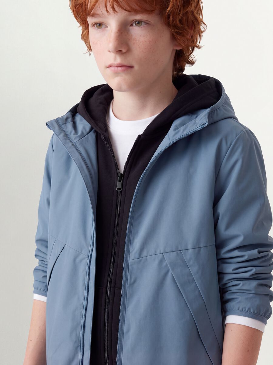 Blue oversized rain jacket with hood and zip for boys_1