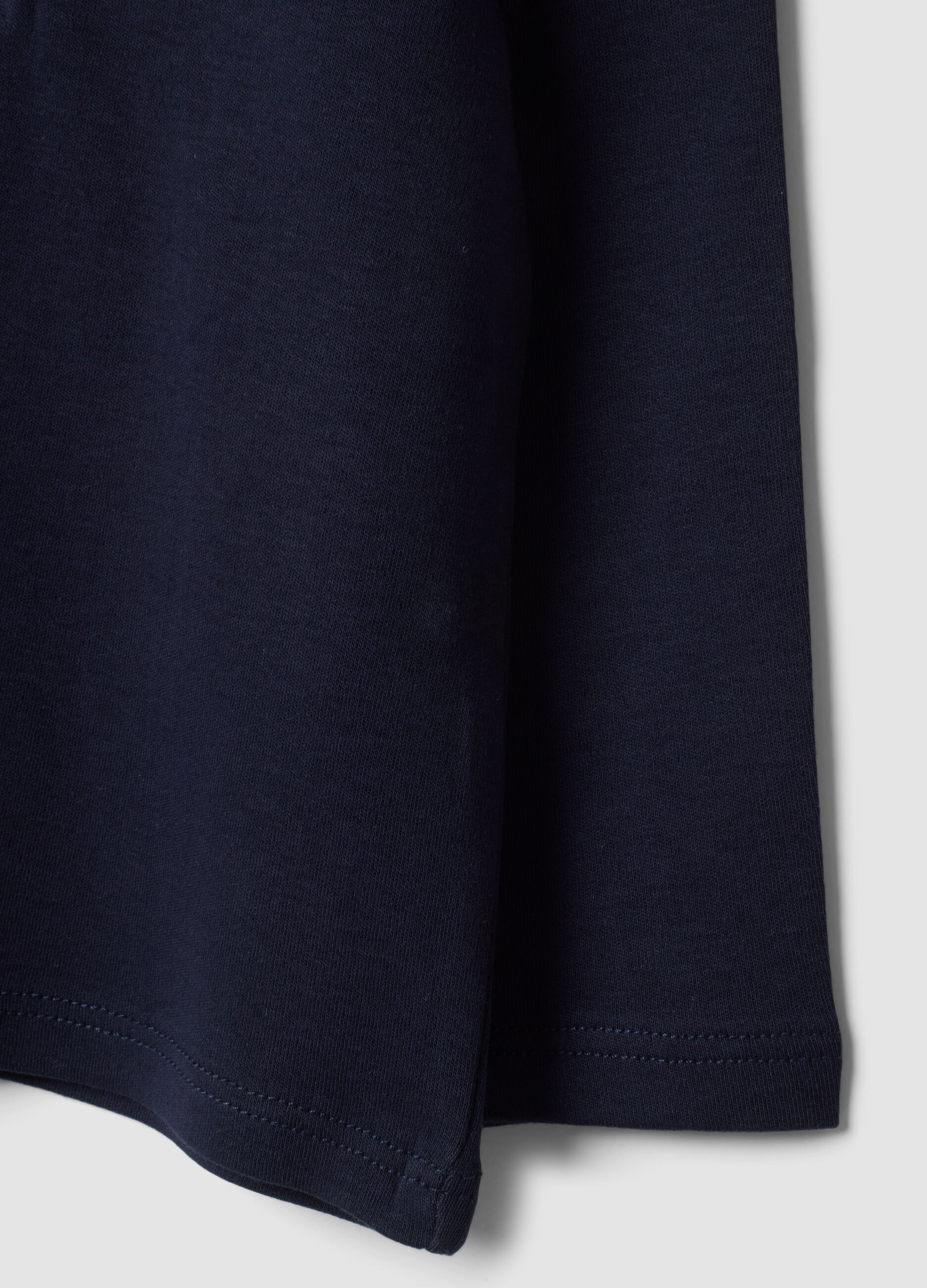Blue organic cotton polo shirt with ruffled collar