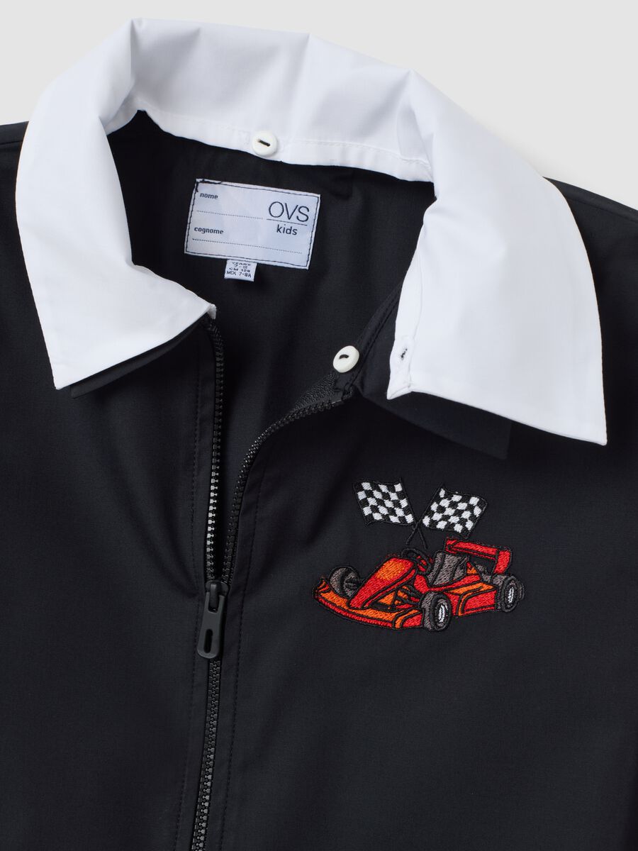 Customisable black school apron with zip and kart embroidery for boys_2