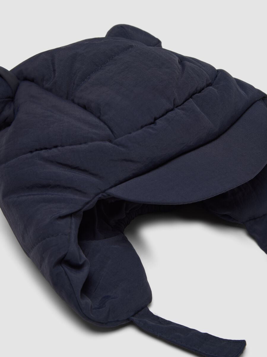 Padded midnight-blue hat with peak and ear flaps_2