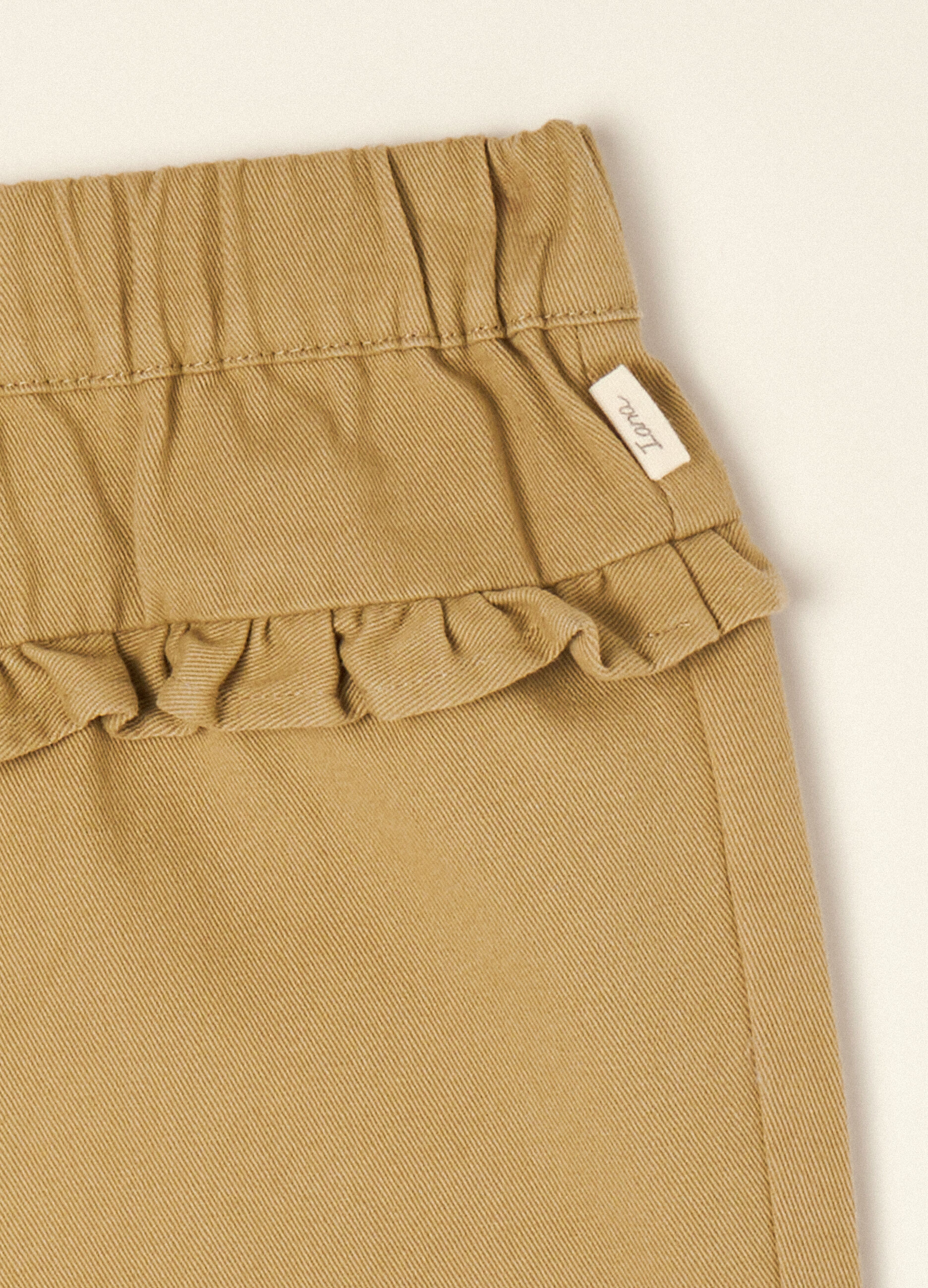 Beige pure cotton trousers with ruffle detail