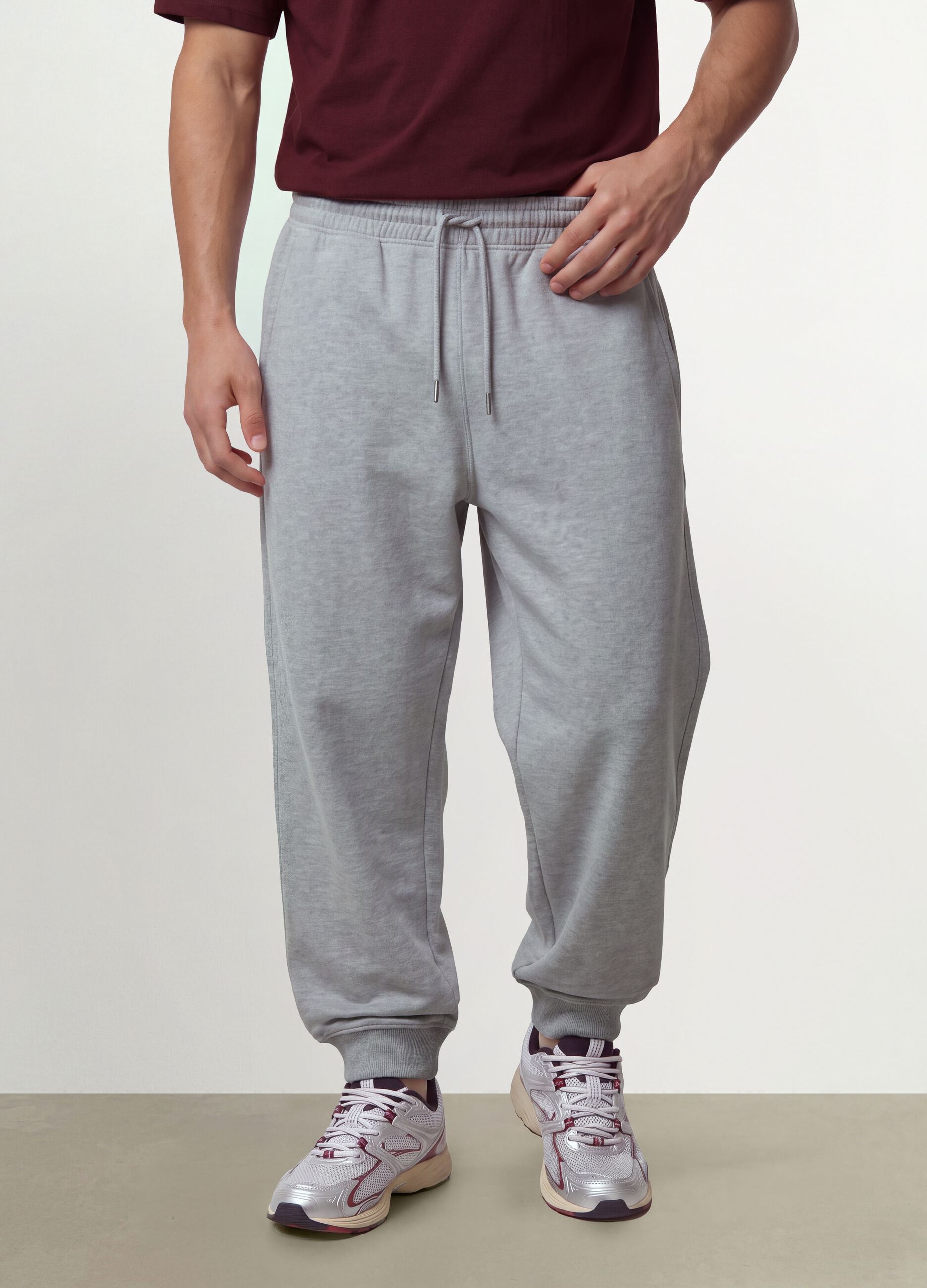 Grey cotton-blend joggers with cuffed hems and drawstring
