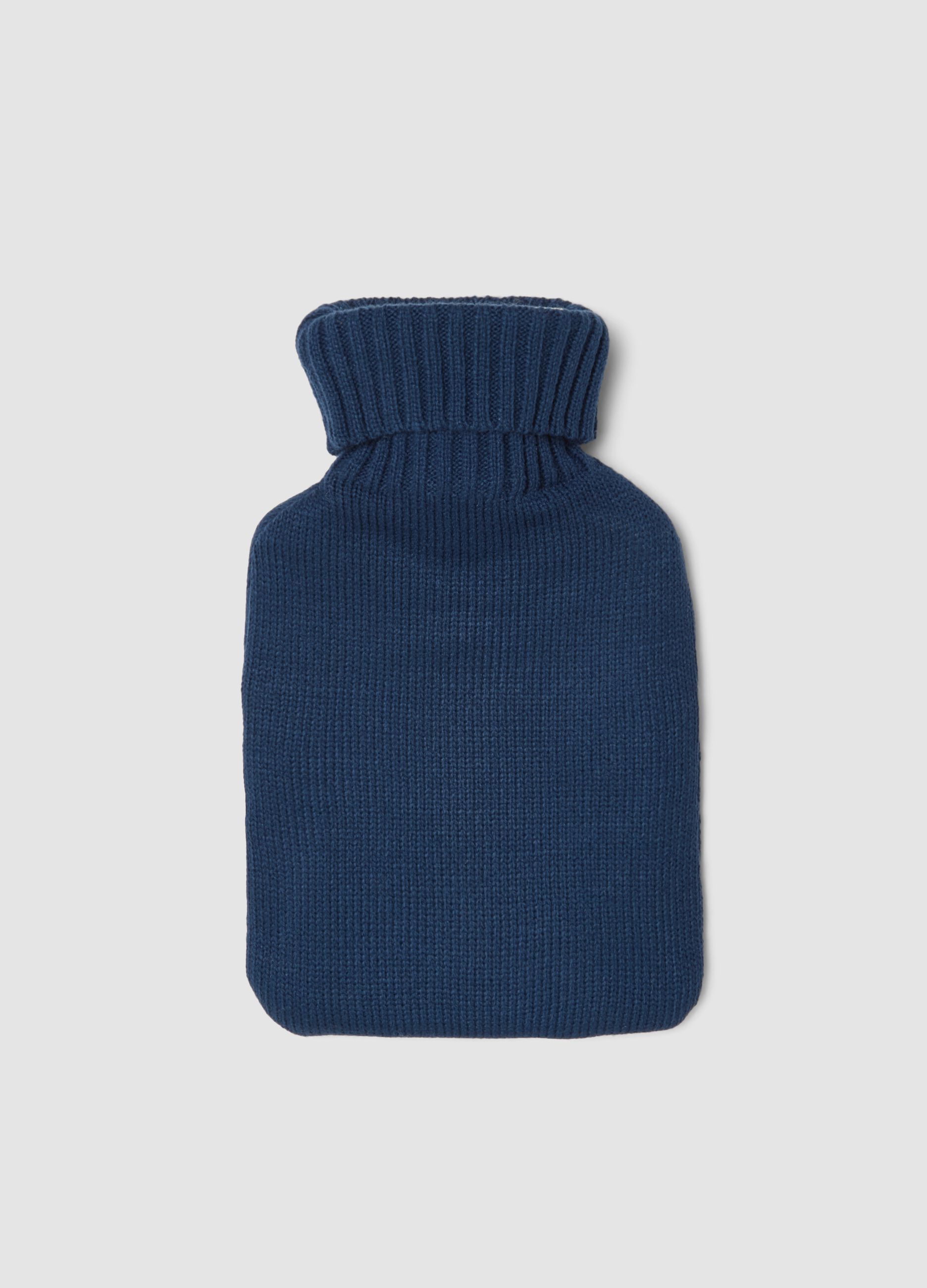 Blue hot water bottle with knitted cover