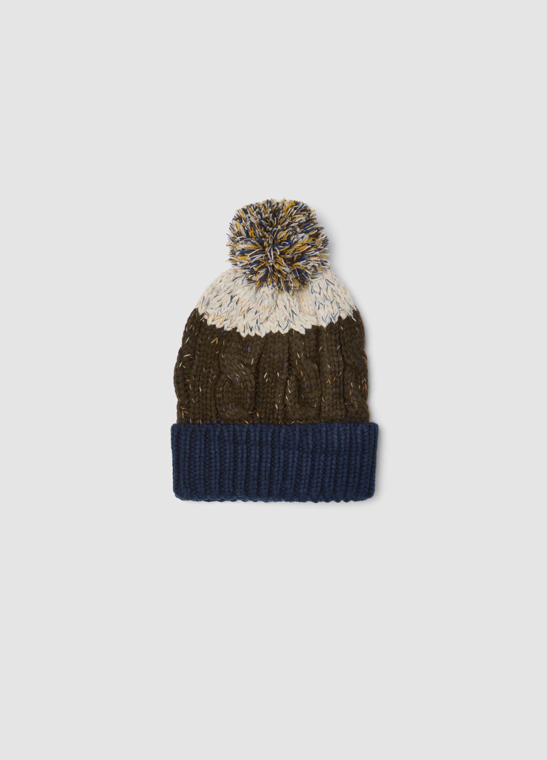 Blue and brown knitted beanie with pom-pom