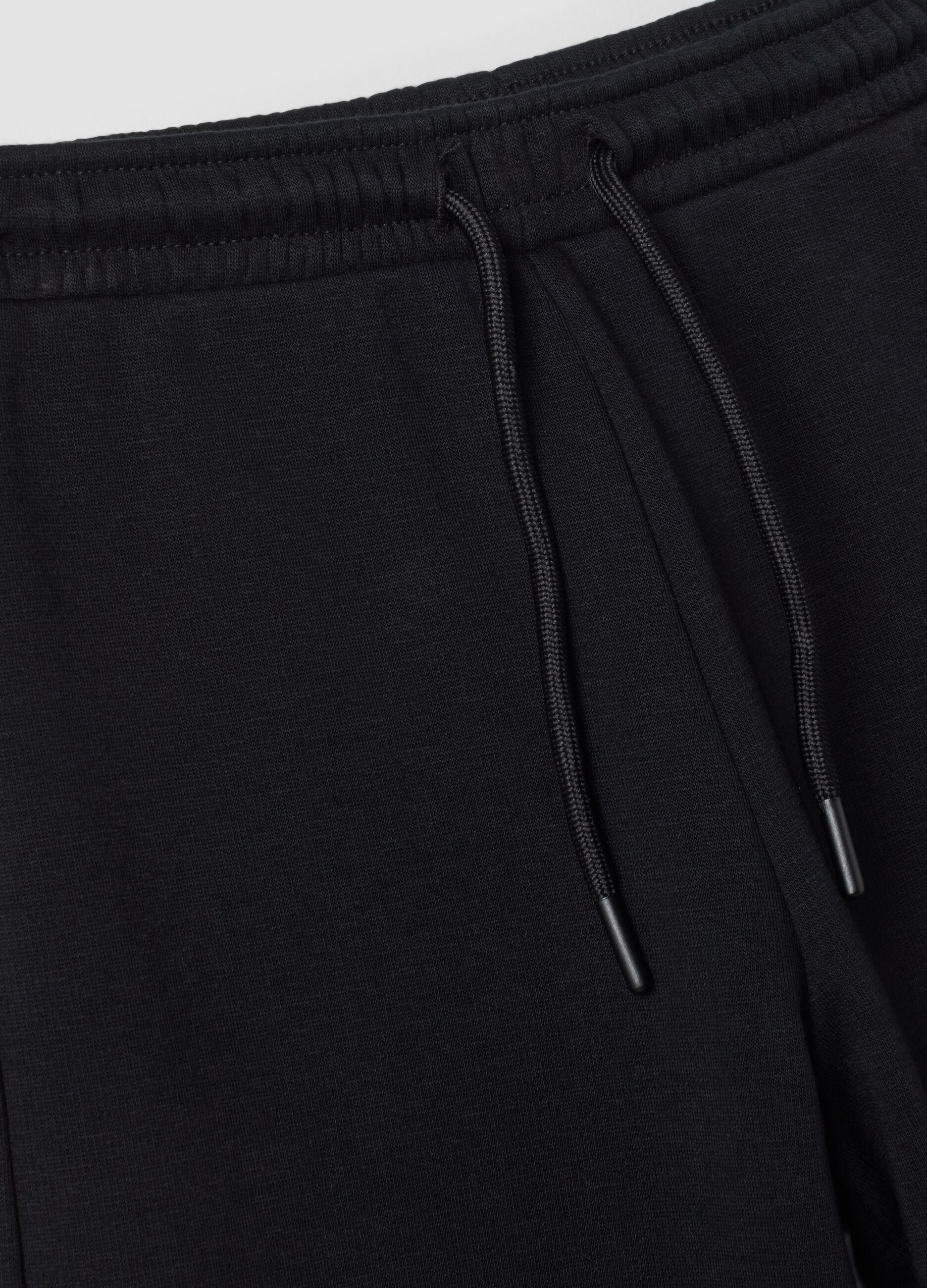 Pantaloni neri wide leg in tessuto fleece elasticizzato