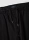 Jogger cargo neri in cotone elasticizzato_1