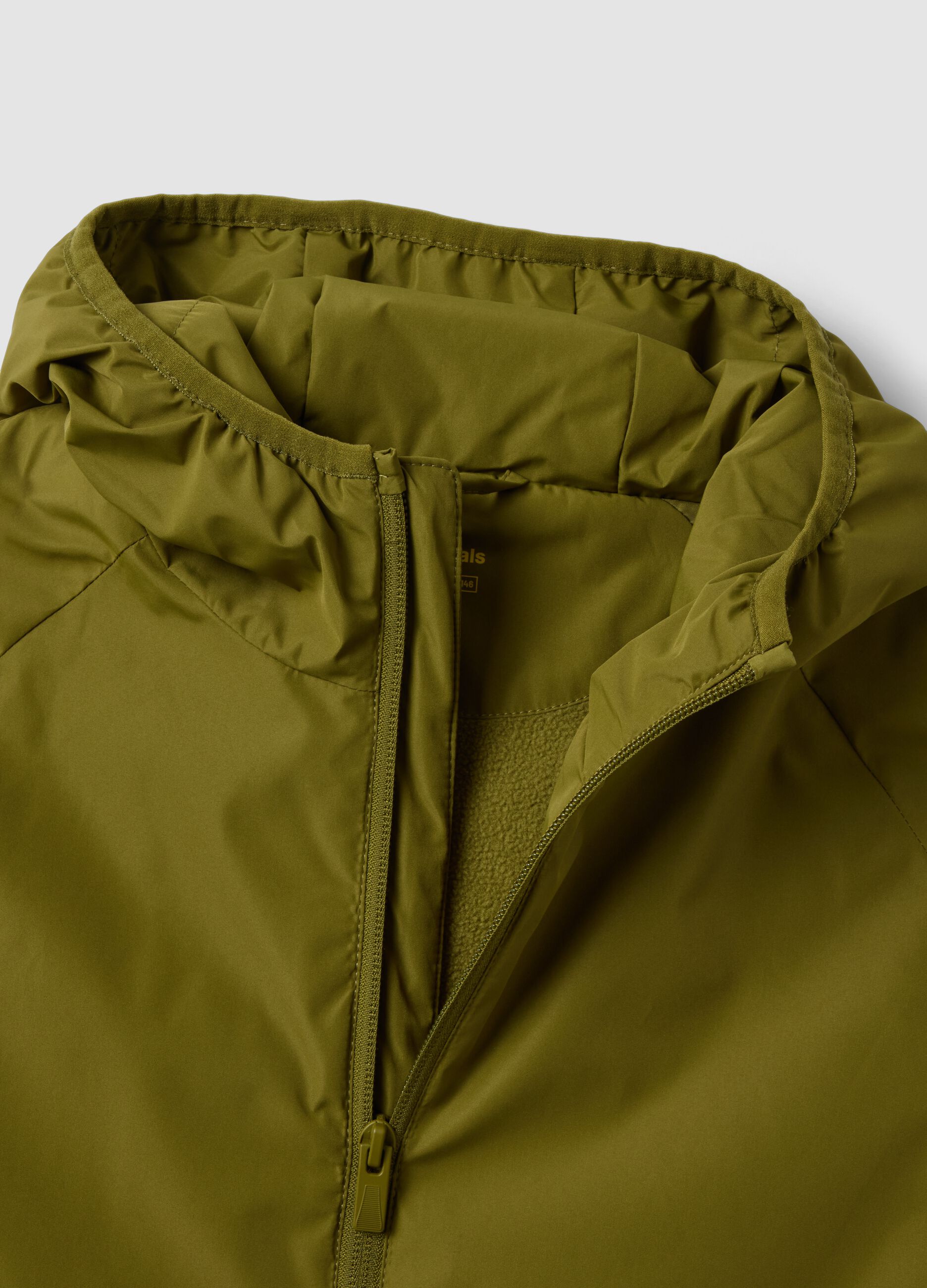 Giacca antipioggia verde con cappuccio e zip per ragazzo